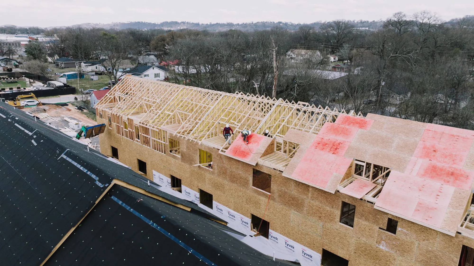 A roof deck part-way through re-covering, with underlayment laid out